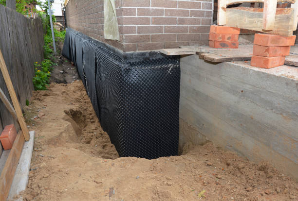 Happy homeowners after waterproofing job in Holgate
